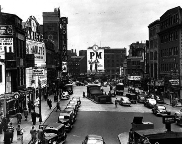 Scollay Square, Boston's entertainment district until the early 1960s, was home to a number of bars frequented by gay men and lesbians. Three of those establishments are visible in this 1940s photo: The Half Dollar (under the "PM" sign); The Lighthouse, to the right of the Half Dollar; and the Crawford House, on the far right.
