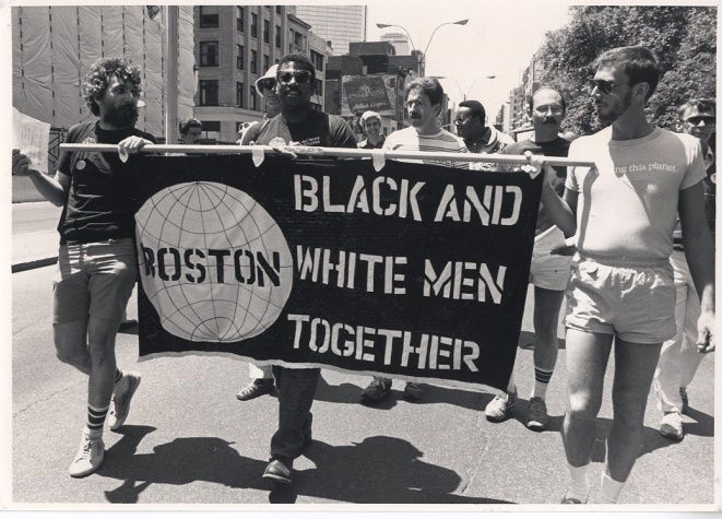 Members of Black and White Men Together march down Boylston St. (Photograph by Susan D. Fleischmann, Gay Community News Collection)