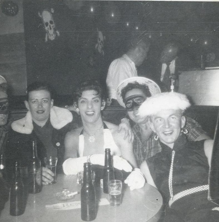 Eddie Bernier and acquaintances in costumes in a Provincetown bar or restaurant, circa 1950s